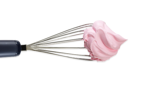metal whisk dipped in pink icing